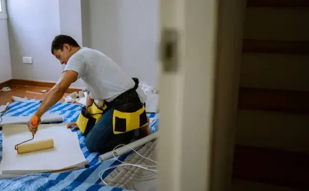 painter painting with roller